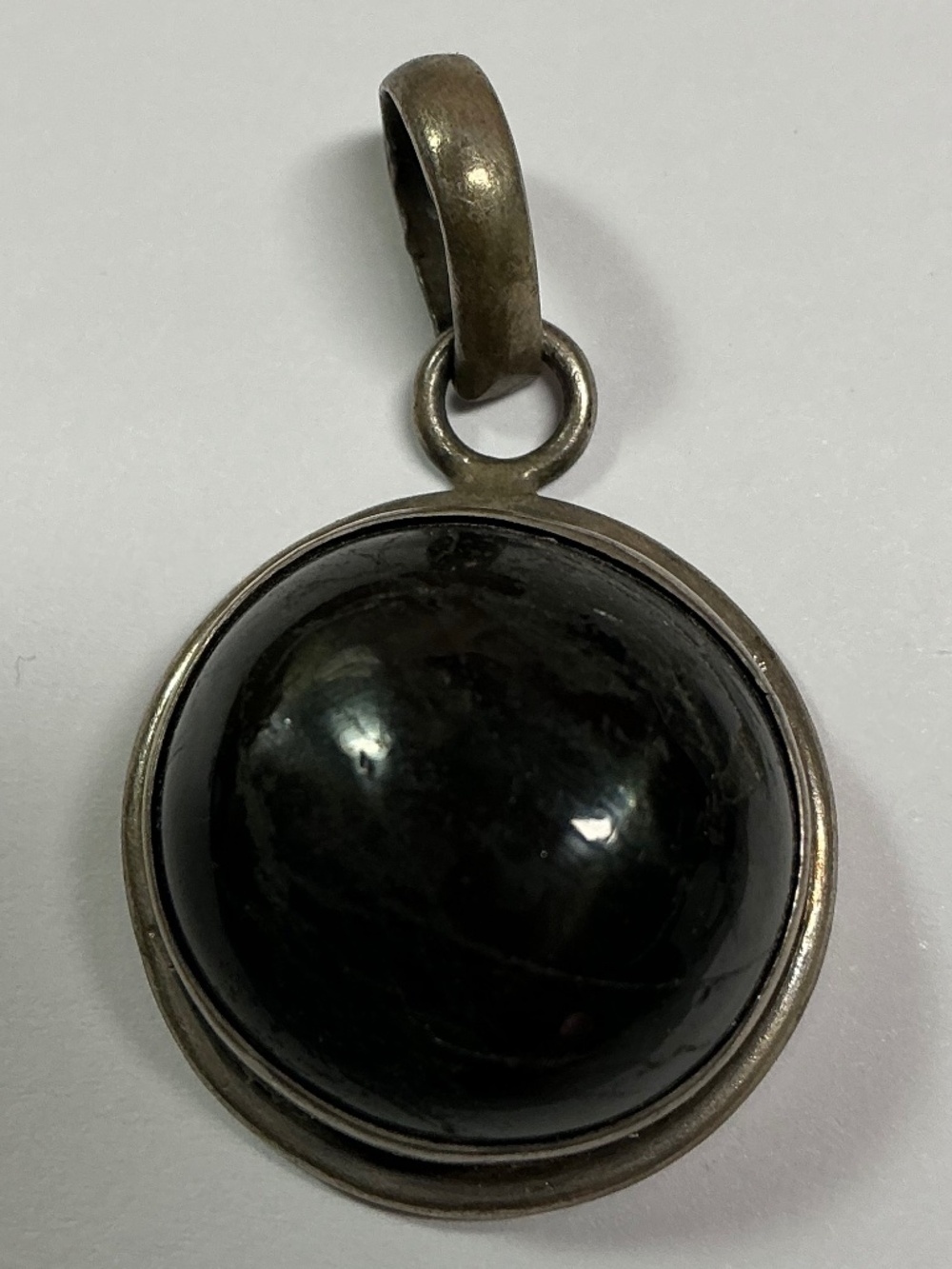 Sterling Silver Pendant with a Black Stone. 7/8 inch diameter